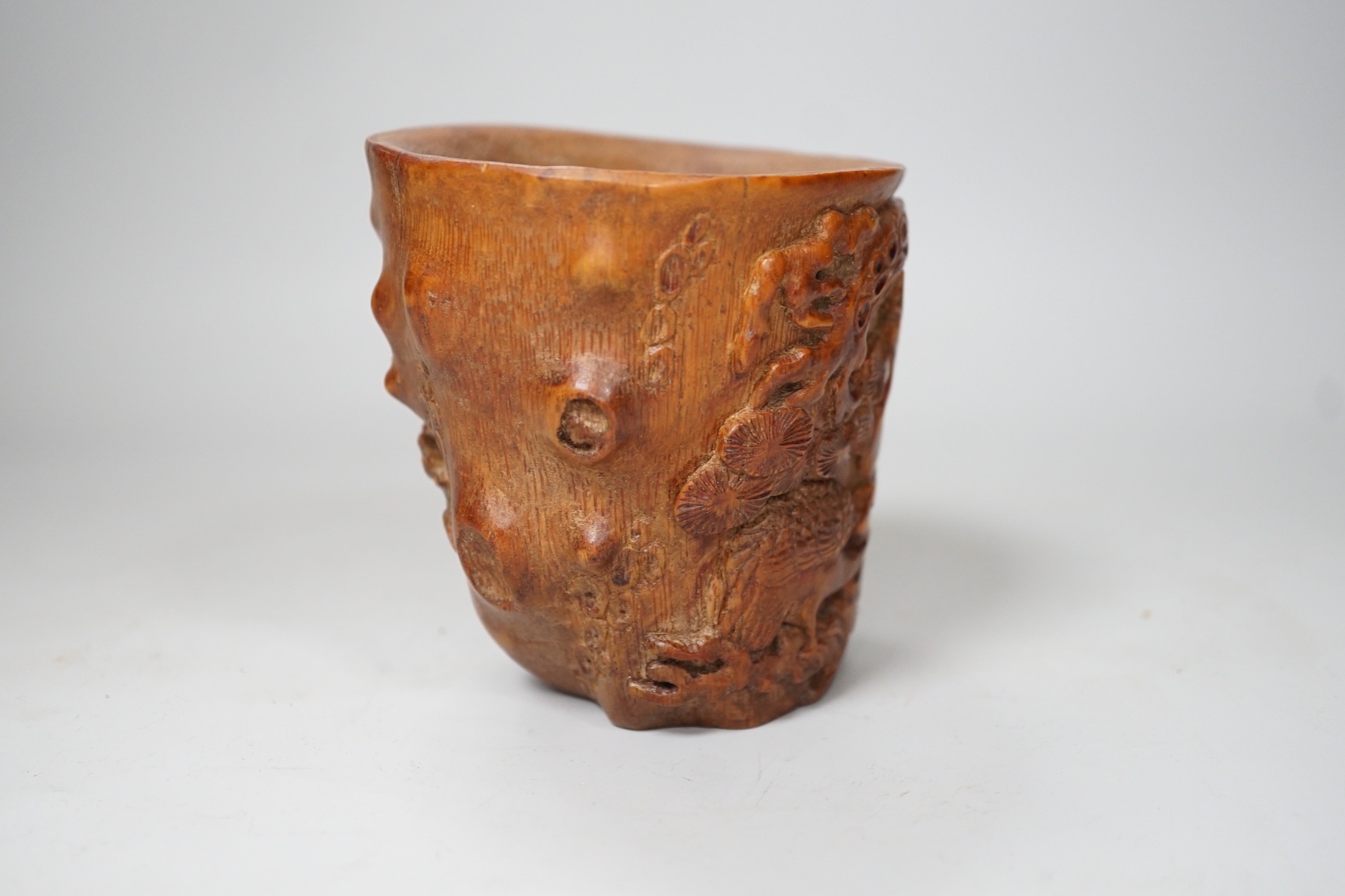 A Chinese bamboo libation cup. 10cm tall